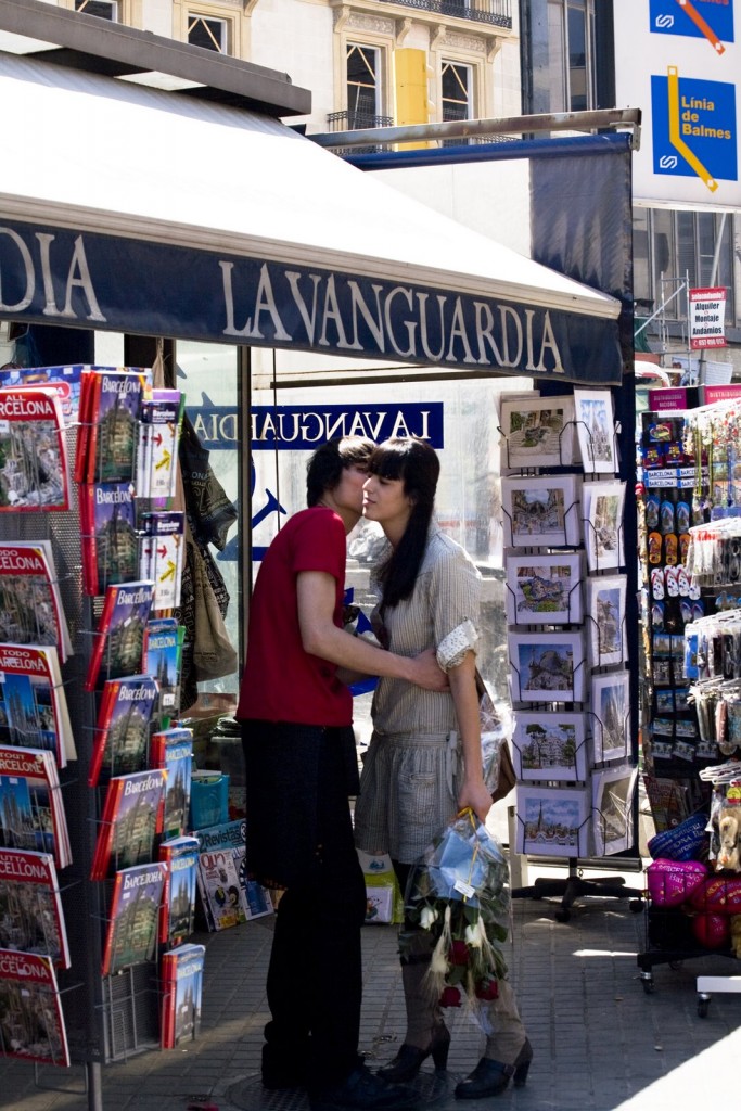 Young couple kissing each other under a kiosk